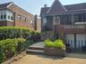 View of front of house featuring brick siding
