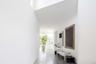 Hallway featuring concrete flooring