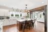 Abundant cabinet space, oversized island and gorgeous farmhouse details