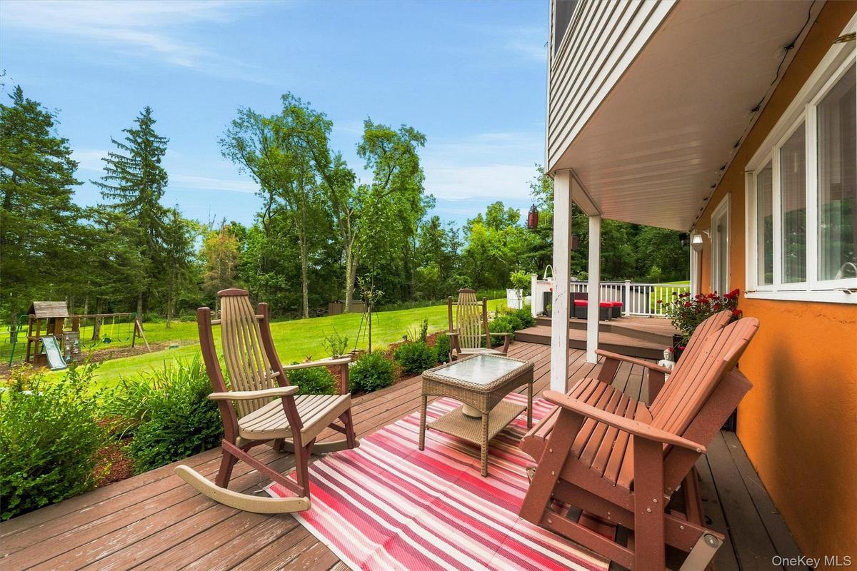 Porch wraps around lower part of the home.