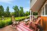 Porch wraps around lower part of the home.
