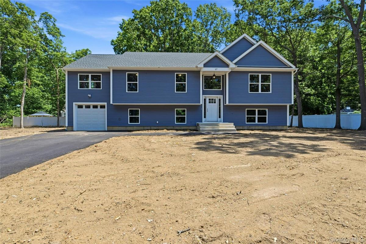 Brand new Raised Ranch just under 3,000 square feet of beautifully designed living space, set on a spacious half-acre lot on a newly developed road.