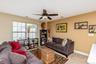 Upstairs Loft featuring a ceiling fan with integrated lighting,
