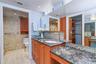 Primary Suite Bath is thoughtfully appointed with separate vanity areas, providing both privacy and convenience, and includes a built-in makeup table