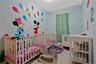Brightly painted interior room featuring light blue walls with colorful murals