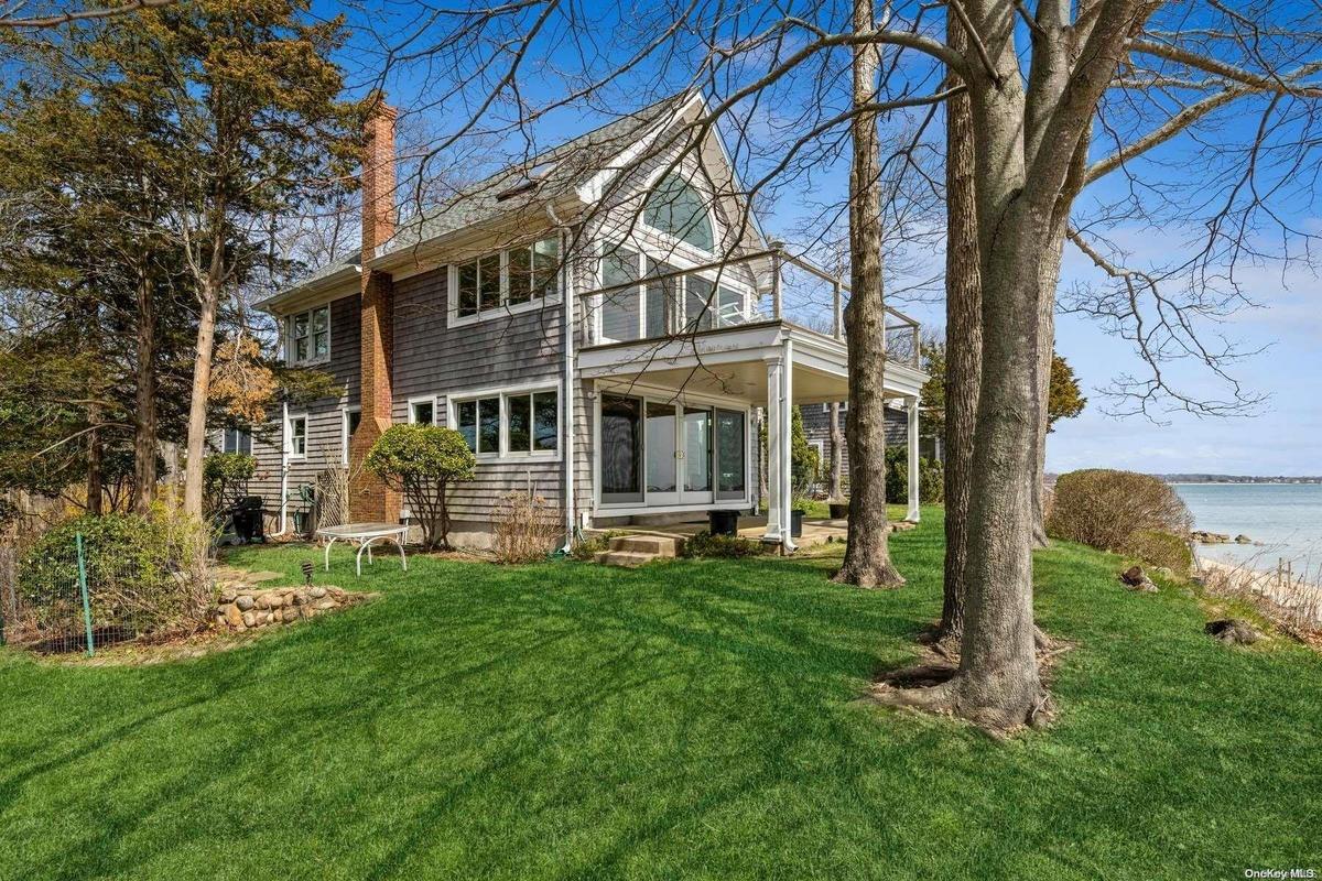 house and bayfront lawn