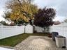 Fenced backyard featuring a patio area
