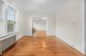 Formal Dining room with 2 large windows, hardwood flooring