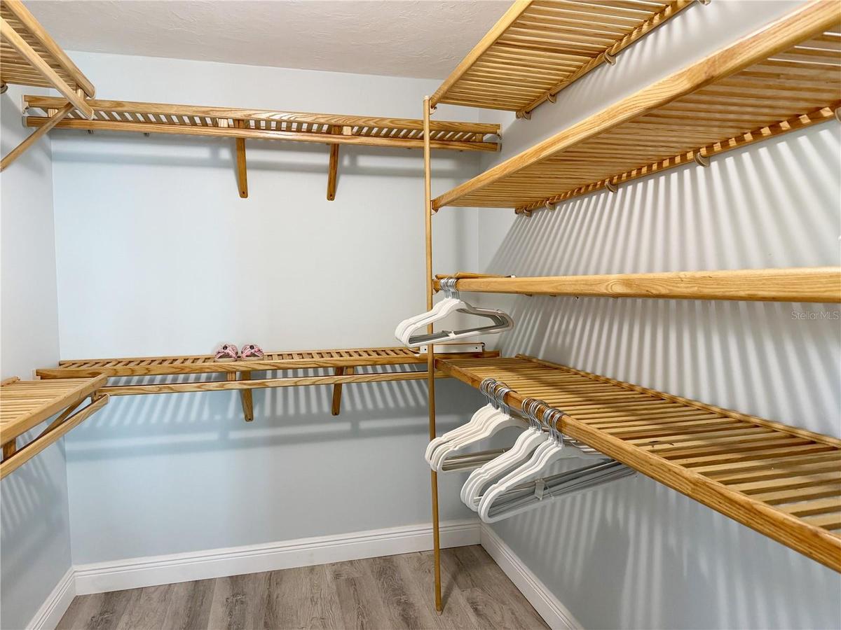 One of two walk-in closets in Primary bedroom.