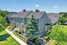 An elevated view showcases the charming landscape, manicured grounds, and thoughtfully designed setting that gives the Warwick Grove community its inv
