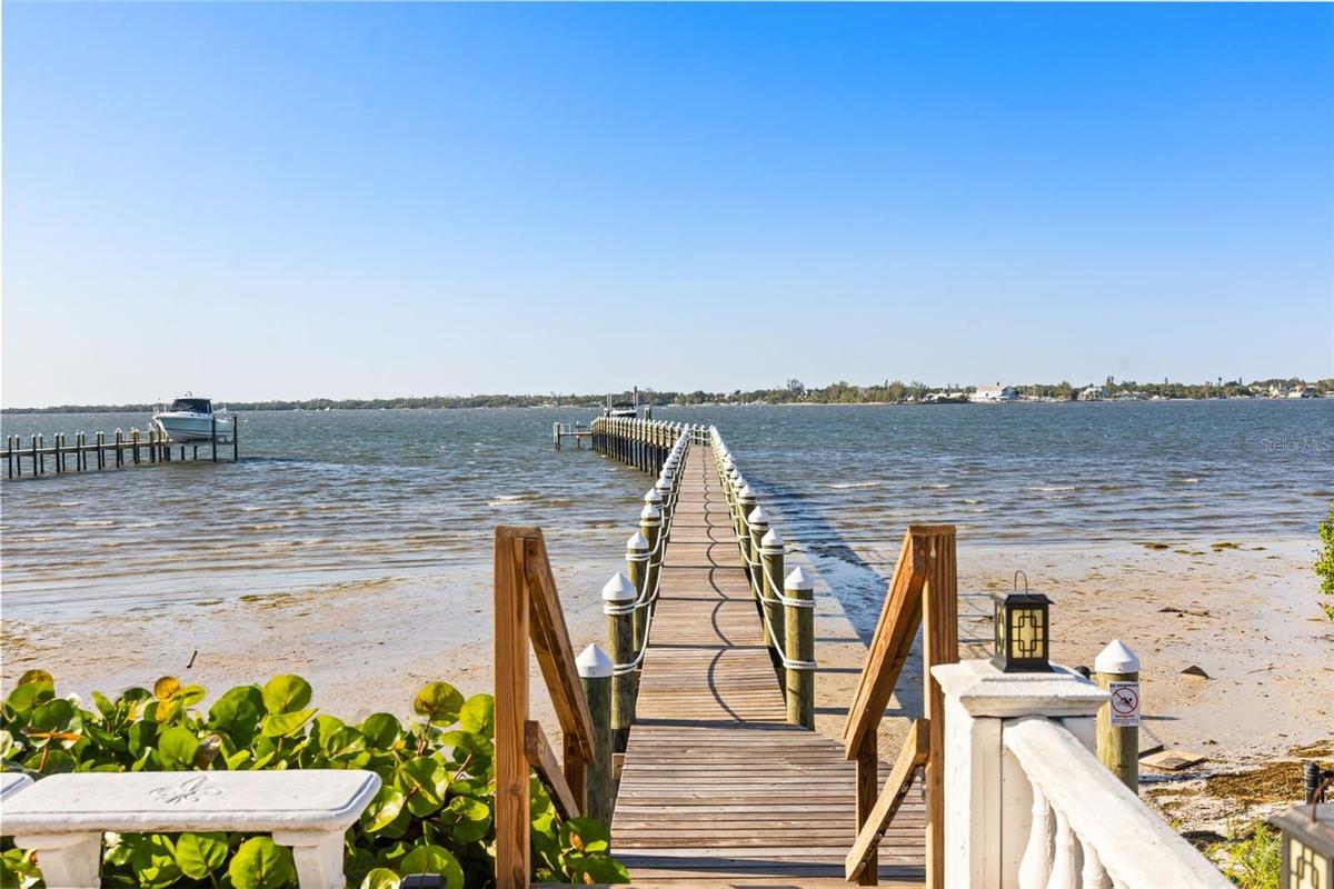 A 400-foot private dock leads you across the Manatee River, offering breathtaking views from this magnificent estate.