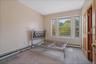 Room with neutral wall paint and baseboard heating