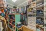 Spacious MASTER BEDROOM closet featuring hardwood / wood-style flooring