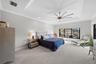 The primary features a tray ceiling and plenty of space