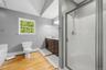 Master bath with stand up shower and double vanities.