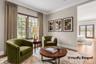 Sitting Room leading to Primary Suite, staged