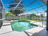 Enjoy your private screened-in pool, perfect for Florida living year-round
