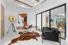 Fourth Bedroom with Striking Glass Wall Overlooking the Second-Floor Interior
