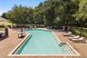 community pool with spa and bathrooms