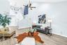 Soaring Vaulted Ceilings connect upstairs to downstairs and frames beautiful artwork and hand selected hanging light fixtures