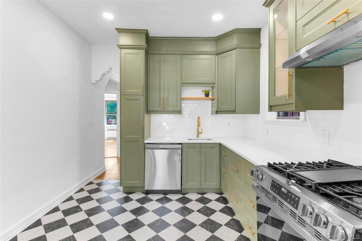 Upper level custom eat-in kitchen with stainless steel appliances