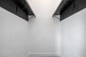 Primary bedroom walk-in closet
