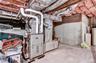 One of two Forced-air heating systems with in-line humidifier and heat pump