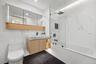 Full bath with toilet, bathing tub / shower combination, vanity, marble finish flooring, and recessed lighting