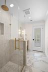 Bathroom with a stall shower, vanity, light marble finish floors, recessed lighting, and crown molding