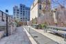 View of property's community featuring a patio, a fenced backyard, and an outdoor kitchen