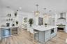 Fabulous center island has lots of drows for pots, a microwave and seating.