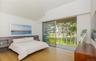 Bedroom with access to exterior, light wood-type flooring, and vaulted ceiling