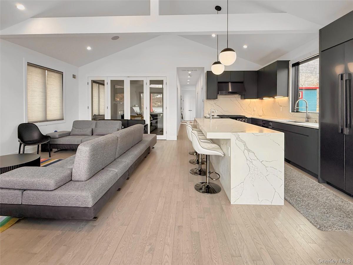 Sliding doors in main living space provide option for additional living space or bedroom