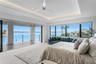 Primary suite's open water view with sliding door pocketed