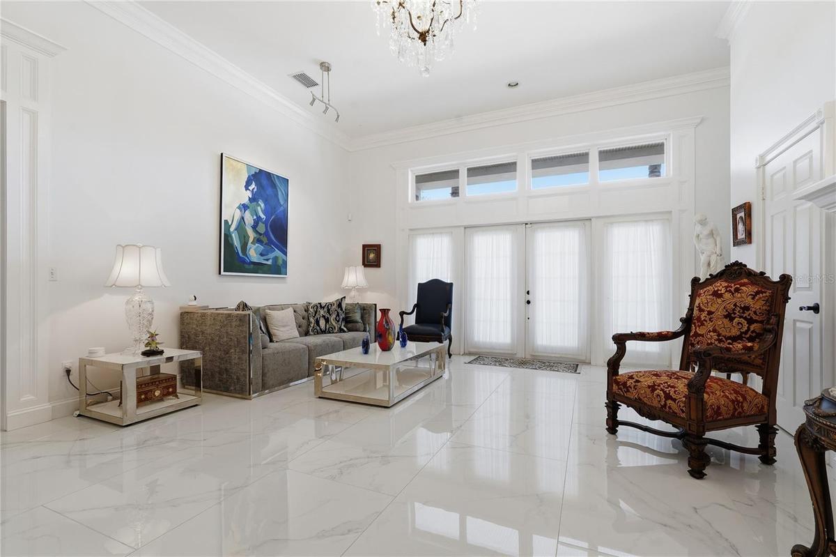 THE ENTRANCE FEATURES 2-1/2' BY 5' WHITE TRAVERTINE TILES