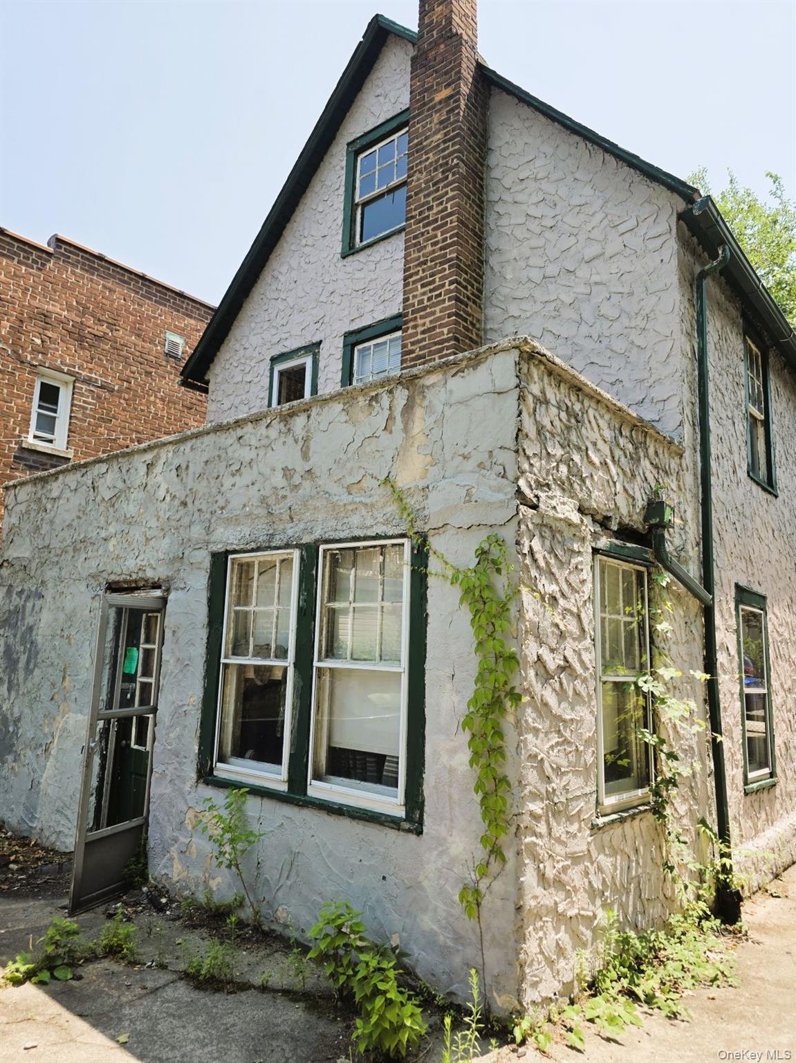 Rear of structure with door access to patio.