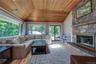 Living Room with Vaulted Ceilings, Natural Wood Floors and plenty of windows