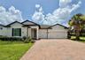 14048 Larkspur Lake Dr - Front exterior with three-car garage and spacious driveway.