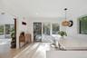 Kitchen with pendant lighting, wooden walls, and light hardwood / wood-style flooring