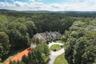 View of subject property with a forest
