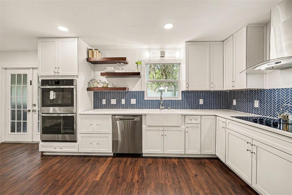 Gorgeous Kitchen with double Stove, cooktop & vented Hood