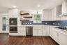Gorgeous Kitchen with double Stove, cooktop & vented Hood