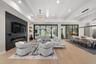 The expansive great room serves as a stunning focal point for the home with soaring 13-foot ceilings.