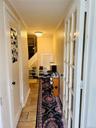 Hall featuring crown molding and stairs