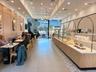 Reception featuring recessed lighting, a chandelier, and a wall of windows