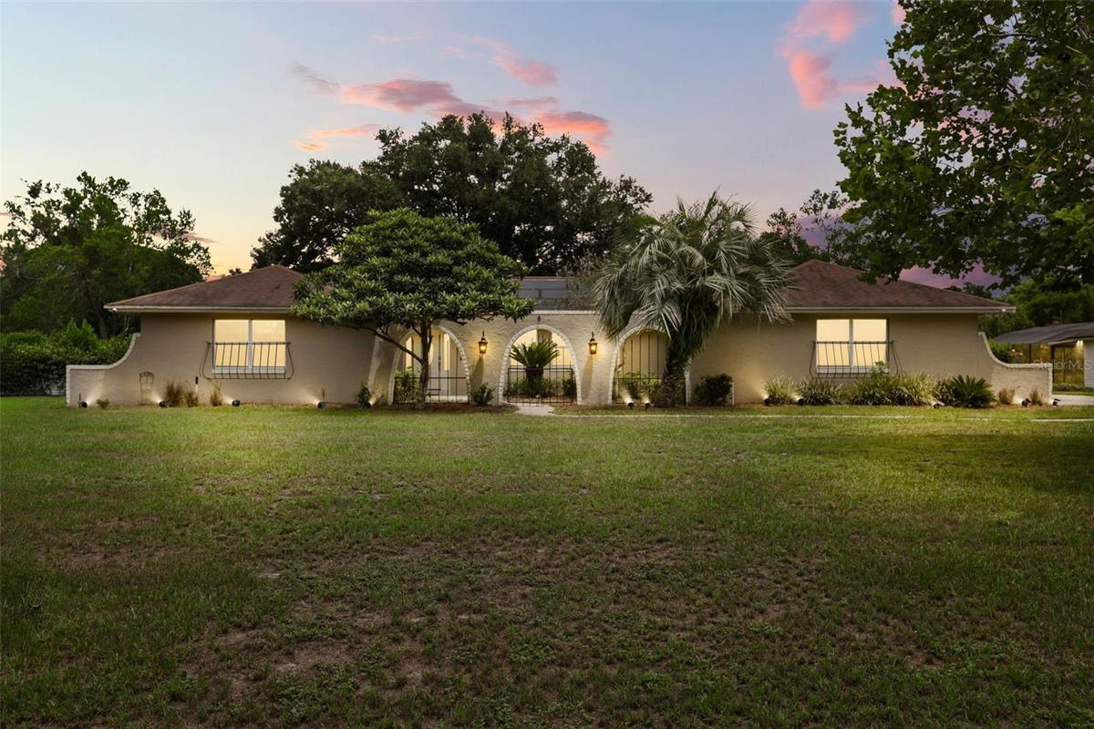 Nestled on an OVERSIZED HOMESITE of well over half an acre in the sought-after Lake Ann Estates of Winter Park.