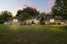 Nestled on an OVERSIZED HOMESITE of well over half an acre in the sought-after Lake Ann Estates of Winter Park.