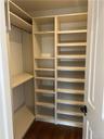 Master Bedroom walk-in closet with lots of organized shelving.