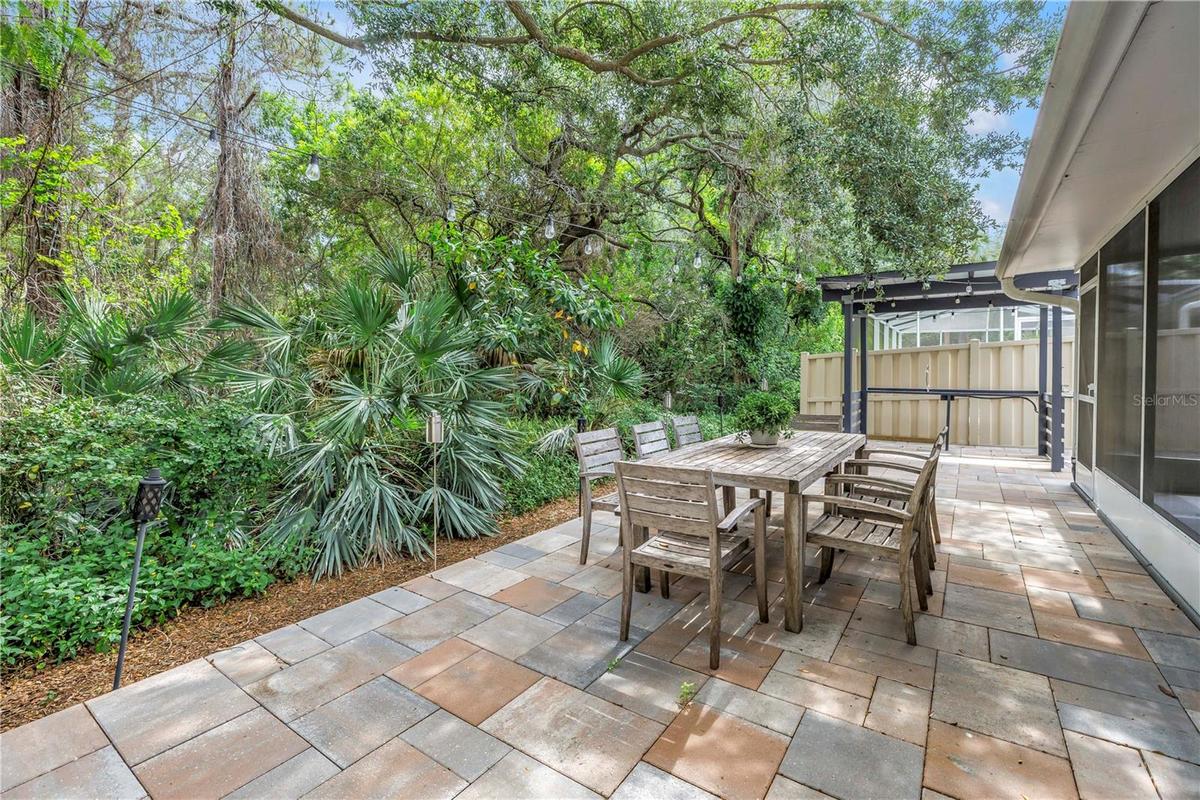 Awesome Shady raised paver patio is perfect for dining, entertaining and gathering
