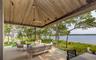 View of patio / terrace featuring an outdoor living space and a deck with water view